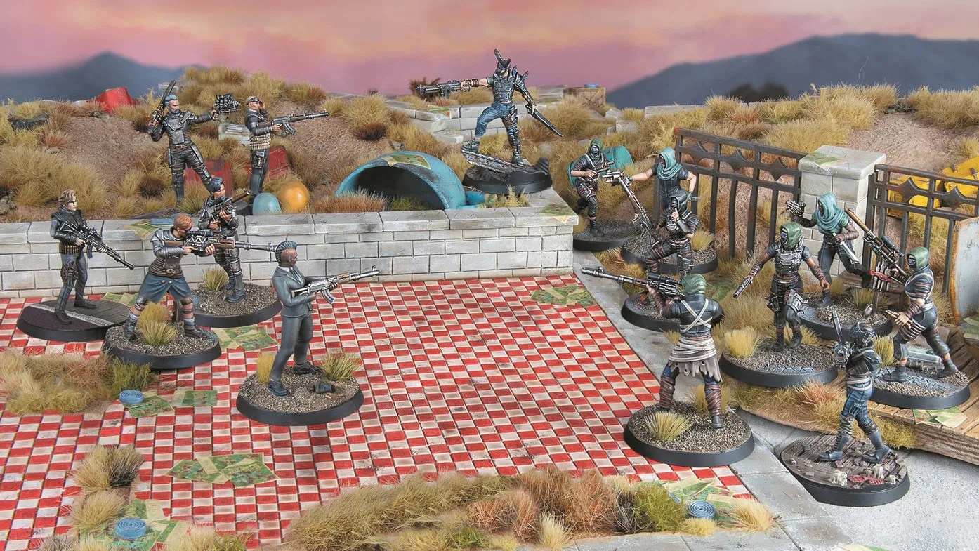 A stock image of several Raider miniatures battling on a tabletop in Fallout: Factions